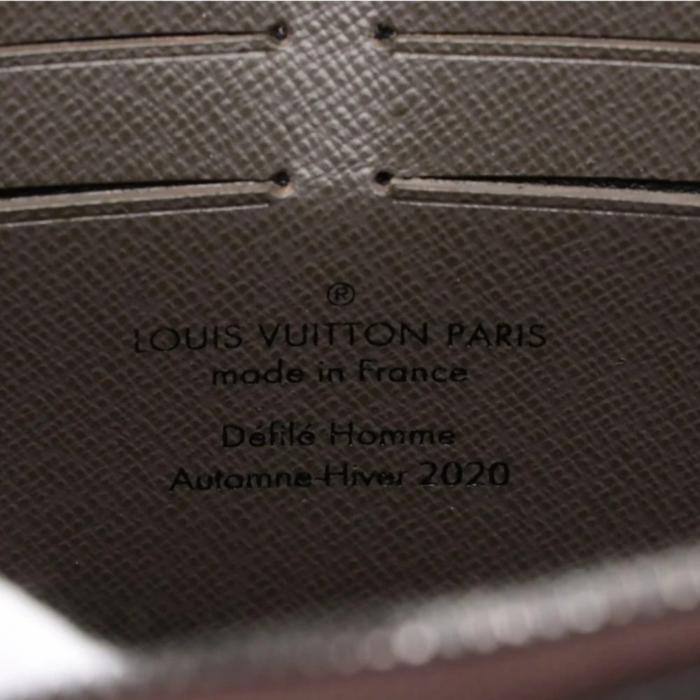 Authentic Louis Vuitton Monogram Taiga Soft Trunk Wallet - Picture 9 of 11